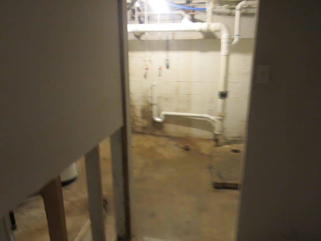 bottom portion of drywall removed due to mold