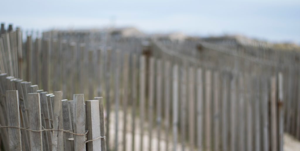simple wooden fence creating barrier on a beach