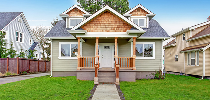 Small house exterior. View of entrance porch with stairs and walkway