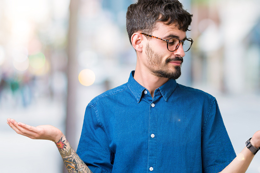 Umbrella Policy vs LLC: Which Is Better for Investors? 1 Young handsome man wearing glasses over isolated background Smiling showing both hands open palms, presenting and advertising comparison and balance