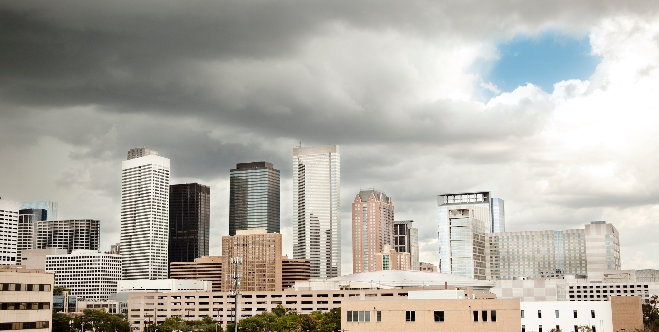 Where Your Investments Are Safest (and Least Safe) From Natural Disasters 2 houston skyline before storm